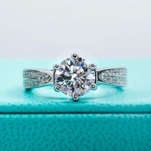 Classic Round-Cut Silver Engagement Ring with Clear Center Stone